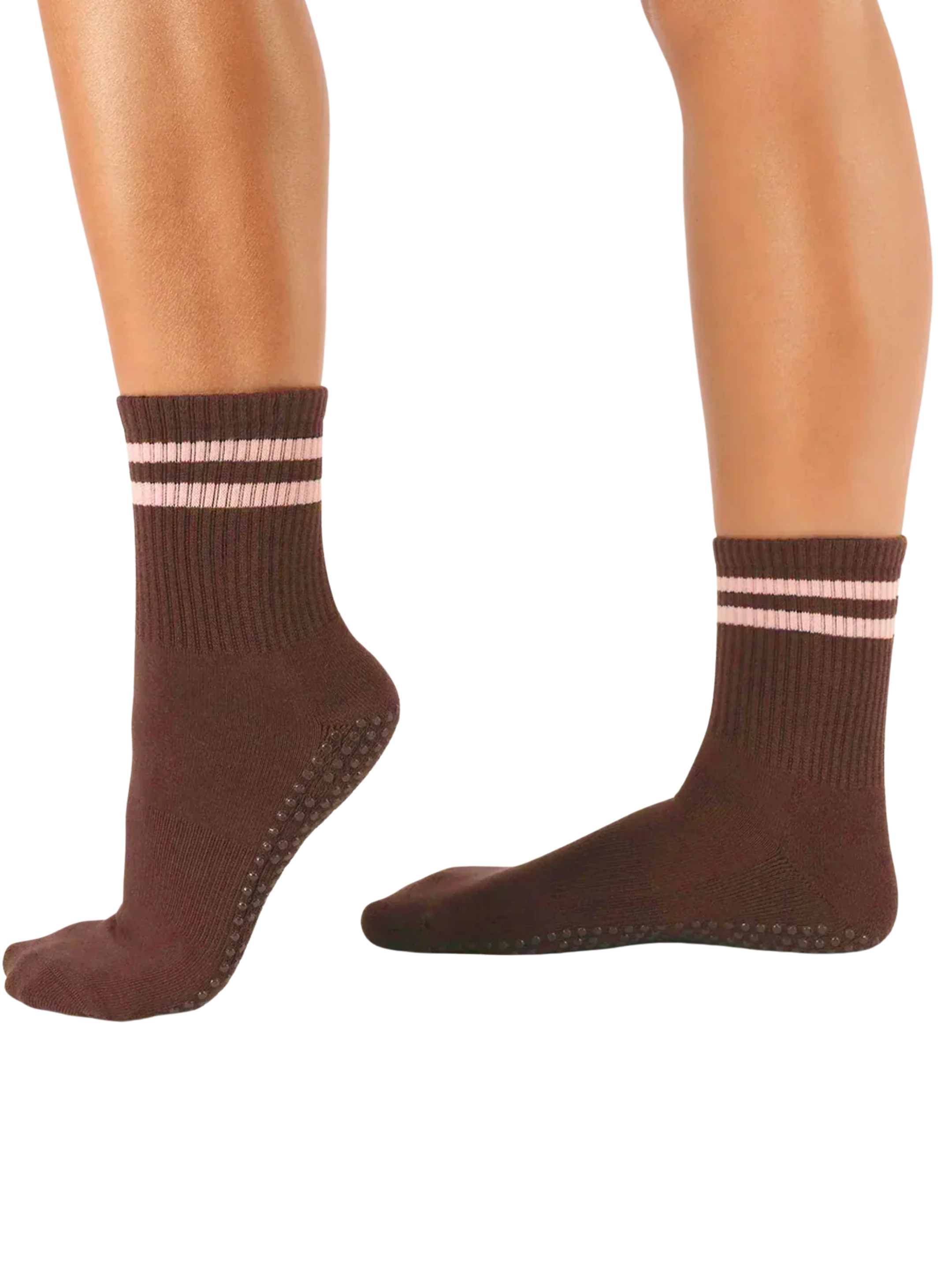 Brown socks with pink stripes worn by a person on a white background