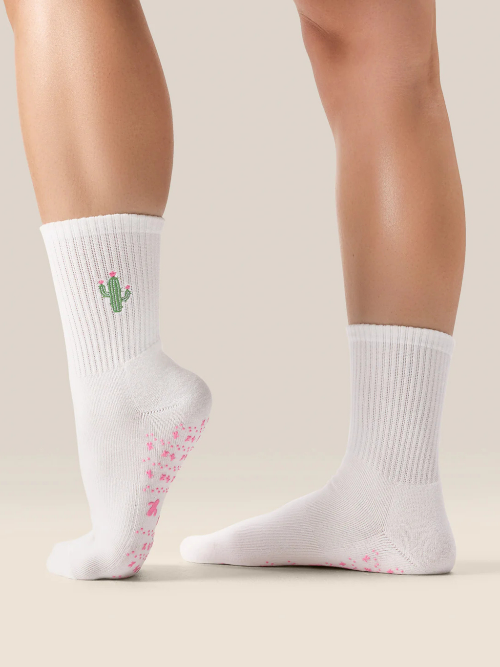 cute Pilates grip socks UK. White socks with cactus design on a neutral background