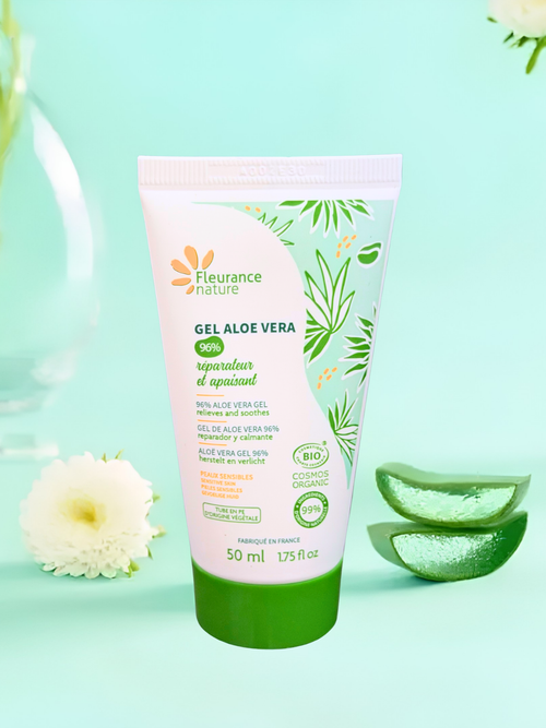 A 50 ml squeeze tube of Fleurance Nature Gel Aloe Vera, featuring a white and green design with aloe vera leaf illustrations, set against a light mint green background with decorative aloe slices and a white flower.