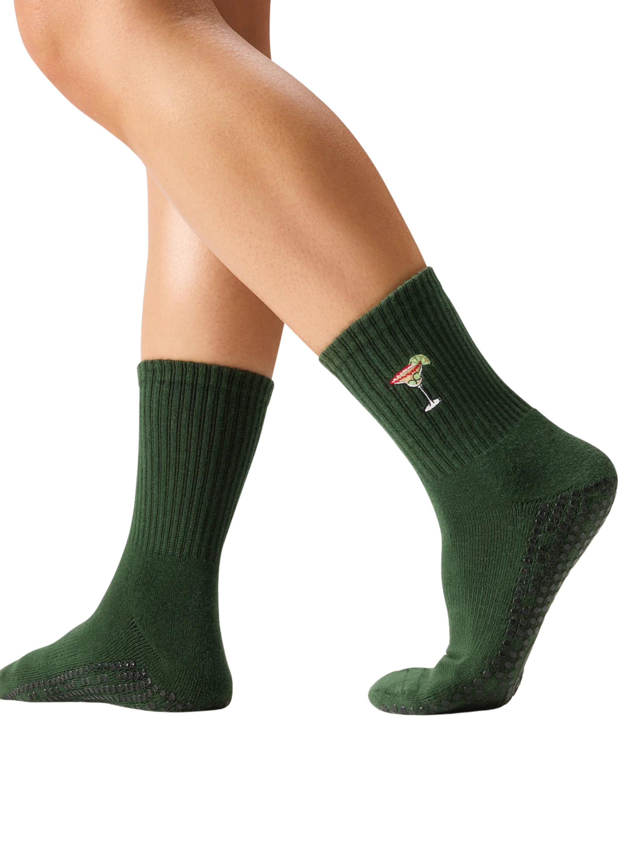 Green socks with a small logo worn by a person on a white background