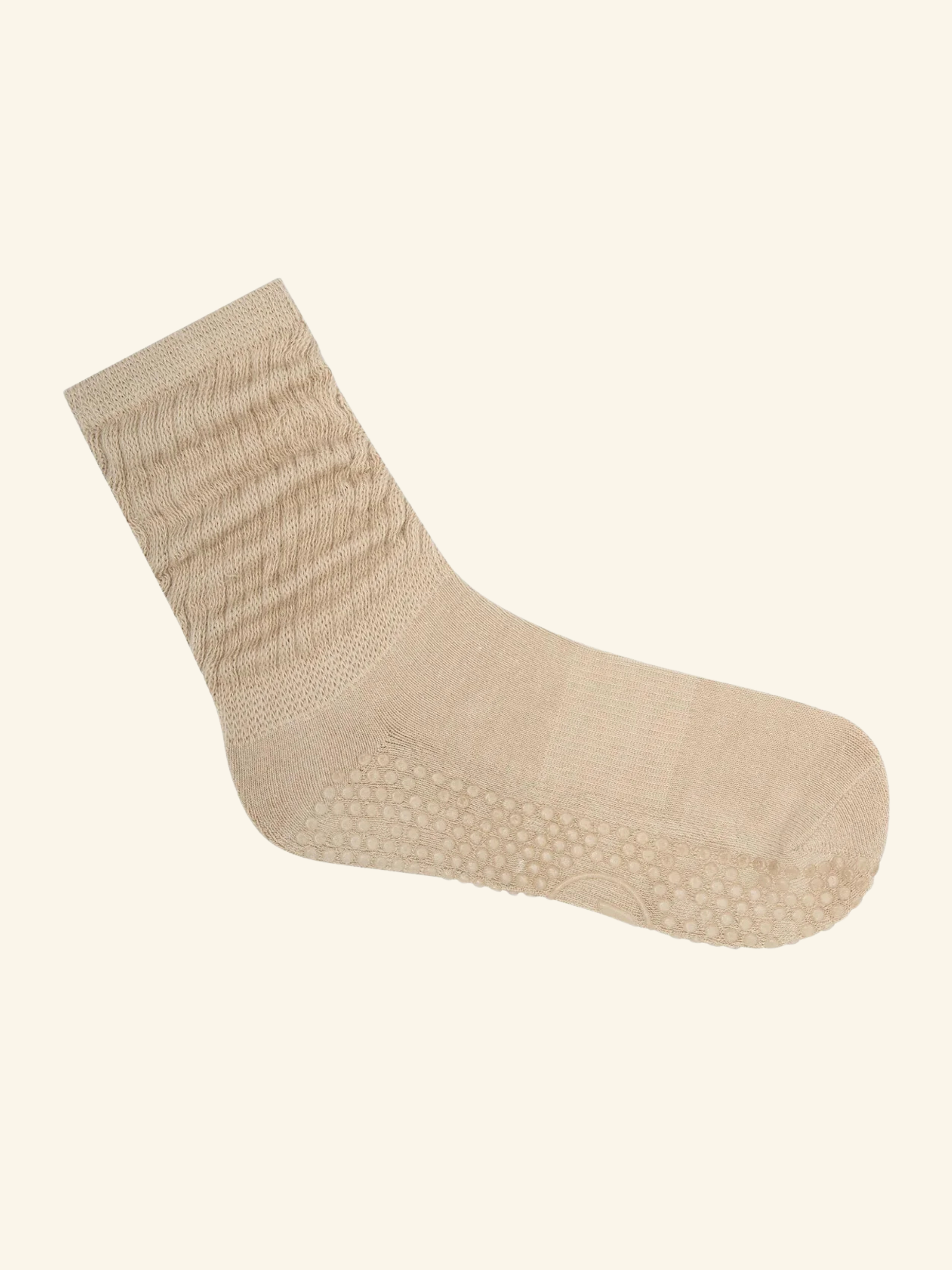 Beige sock on a light beige background