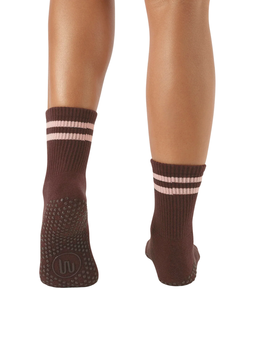 Brown socks with striped design worn by a person on a white background