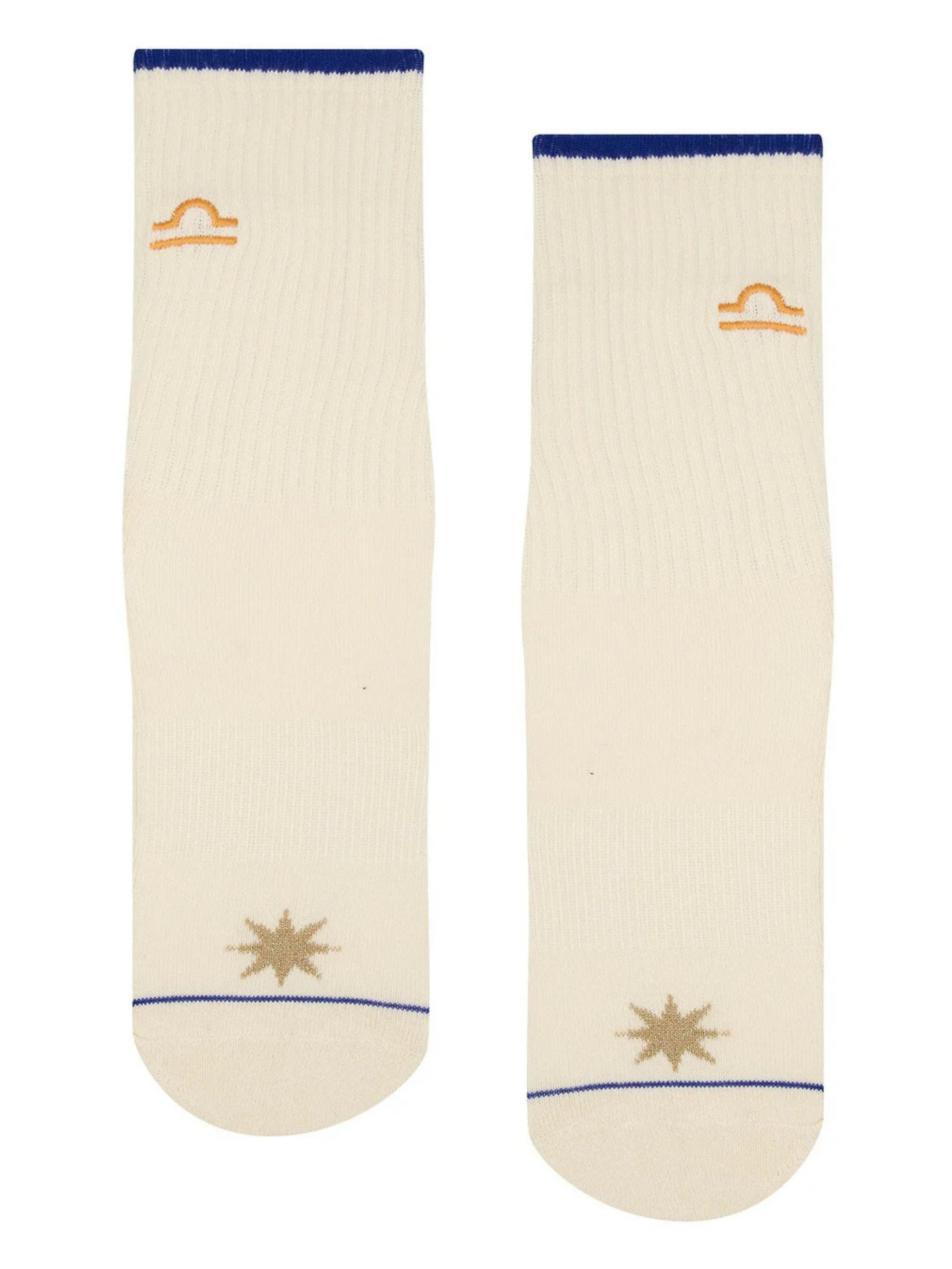 Two cream-colored socks with blue accents and star designs on a white background