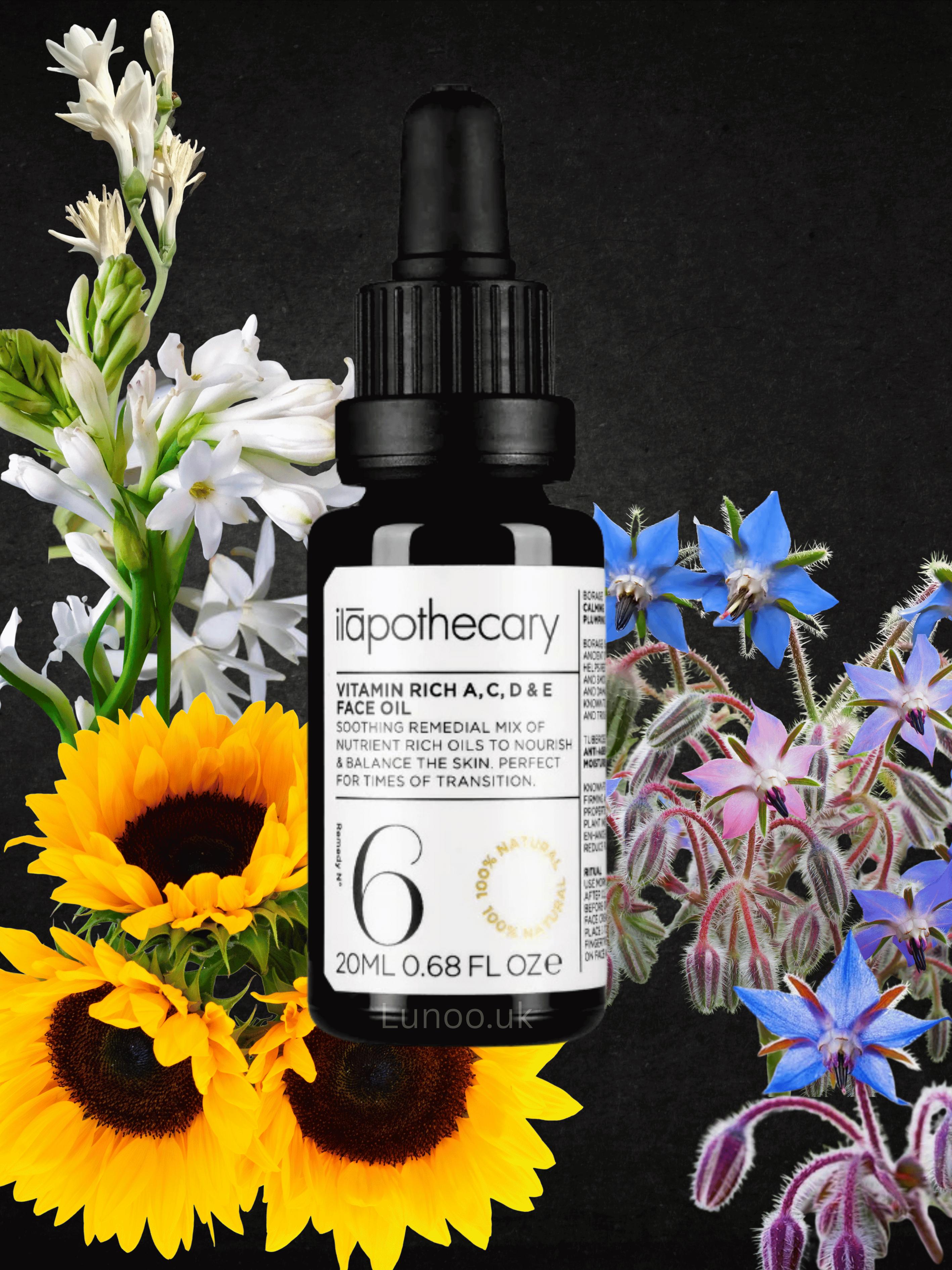 Bottle of 'ilapothecary' vitamin-rich serum surrounded by flowers on a black background
