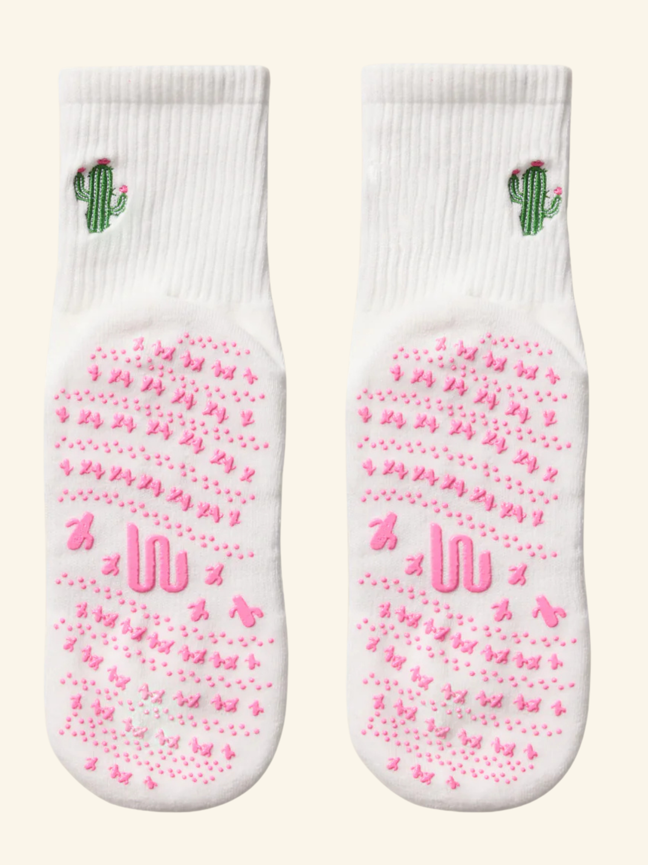 cute Pilates grip socks UK. White socks with pink butterfly pattern and green cactus design on a white background