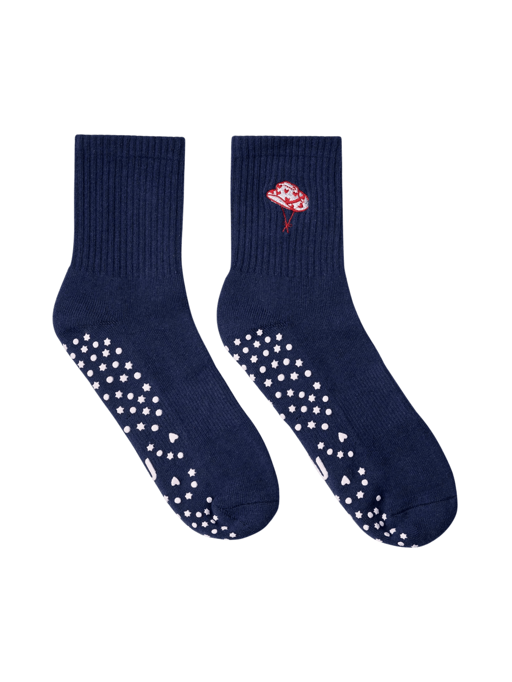 Navy blue socks with white slip-resistant dots and a red flower design on a transparent background