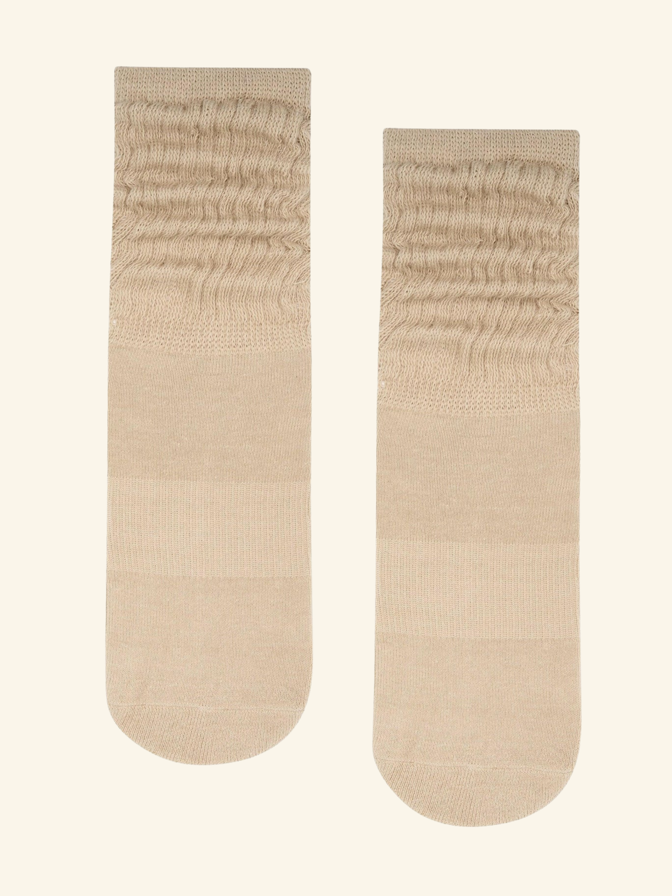 Pair of beige socks on a white background