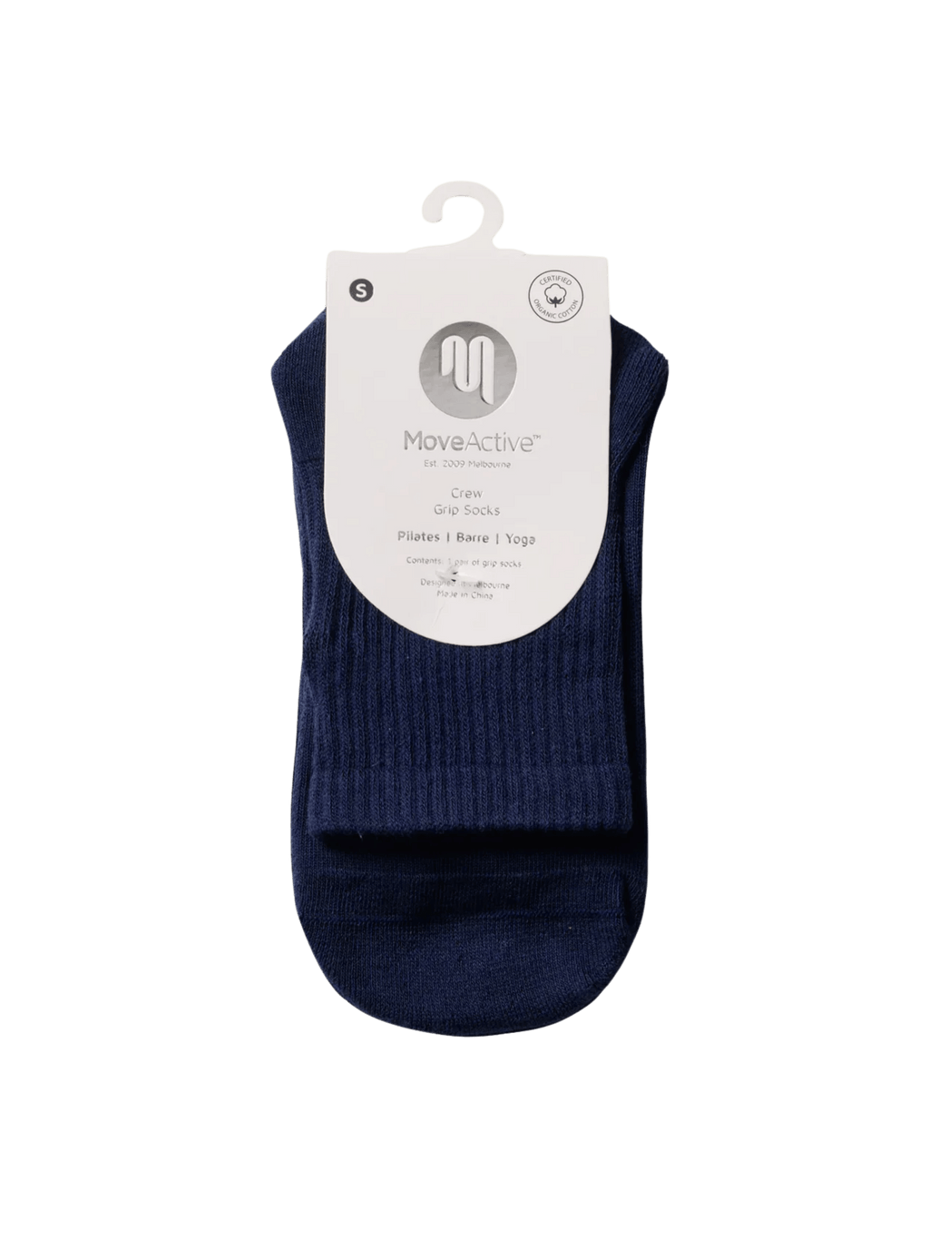 Navy ankle sock on a hanger with a white label against a green background