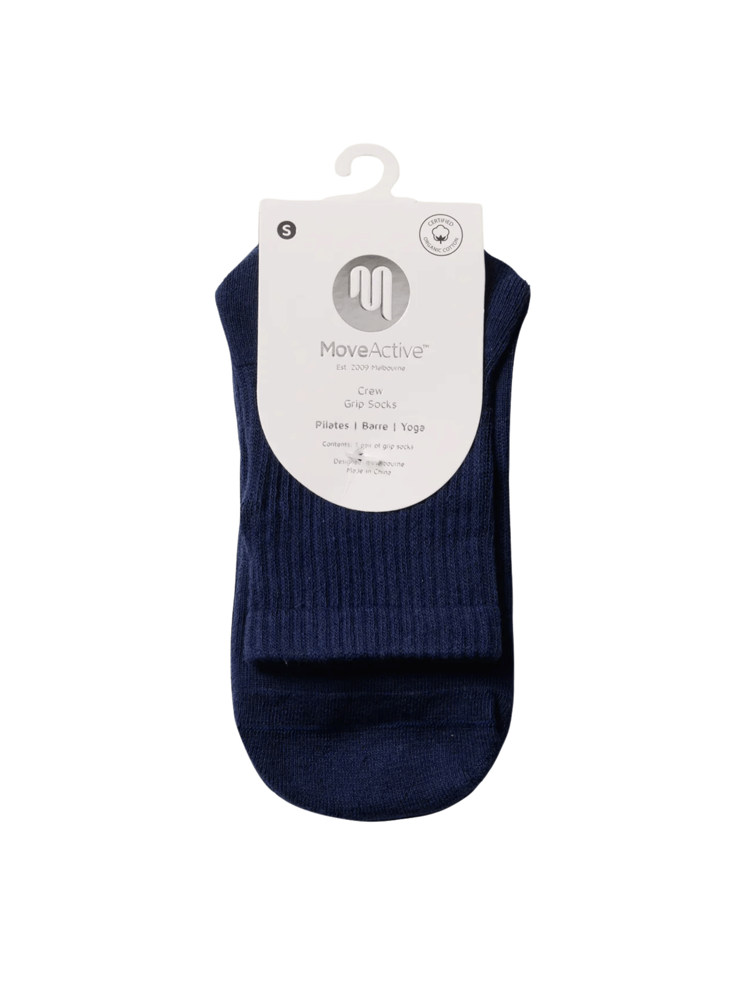 Navy ankle sock on a hanger with a white label against a green background