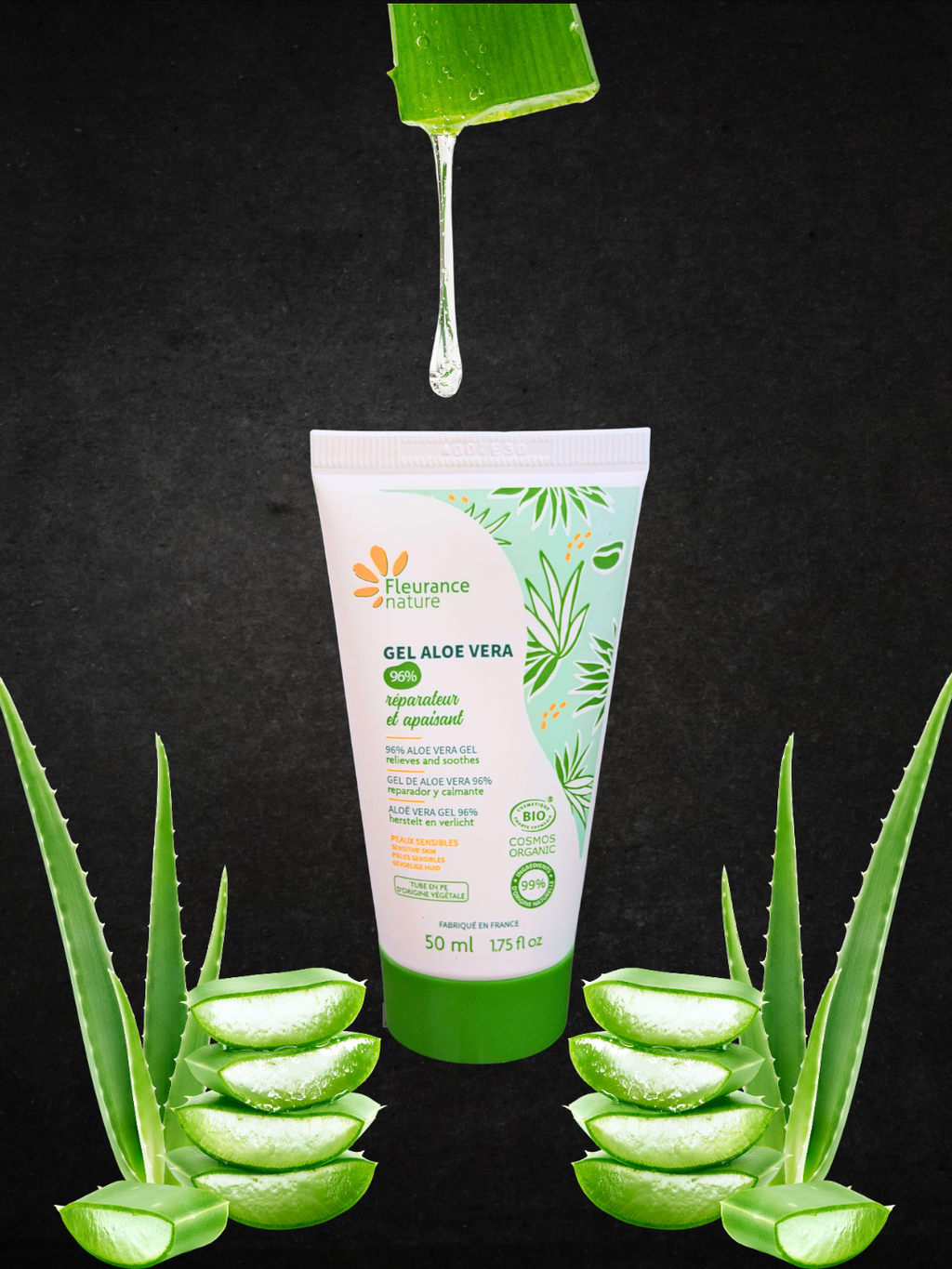 A 50 ml squeeze tube of Fleurance Nature Aloe Vera Gel centered on a black background, with aloe vera slices arranged around the base and a green aloe leaf dripping gel above the tube.
